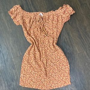 Off the shoulder flower orange dress.